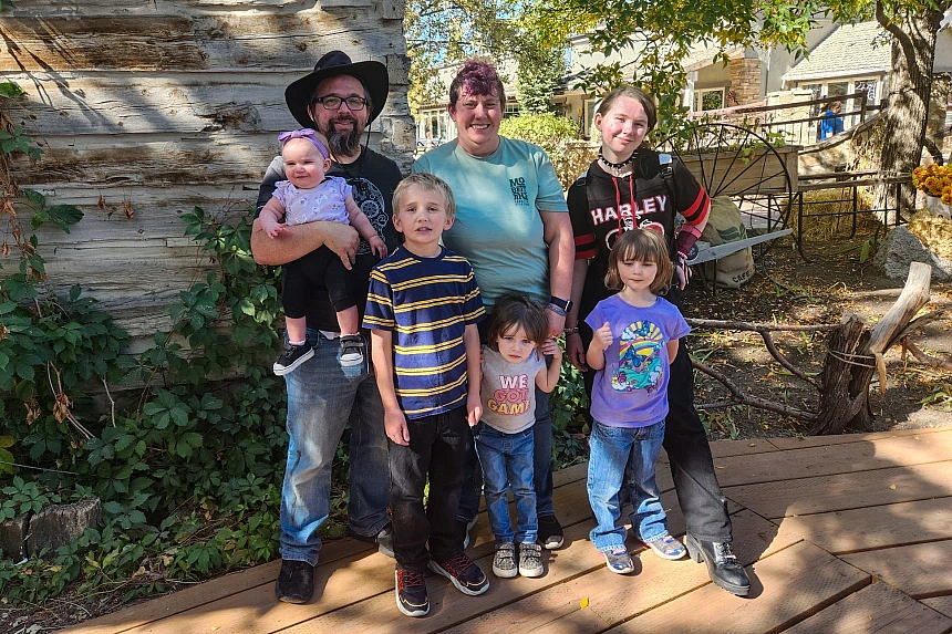 2 people standing with 5 children