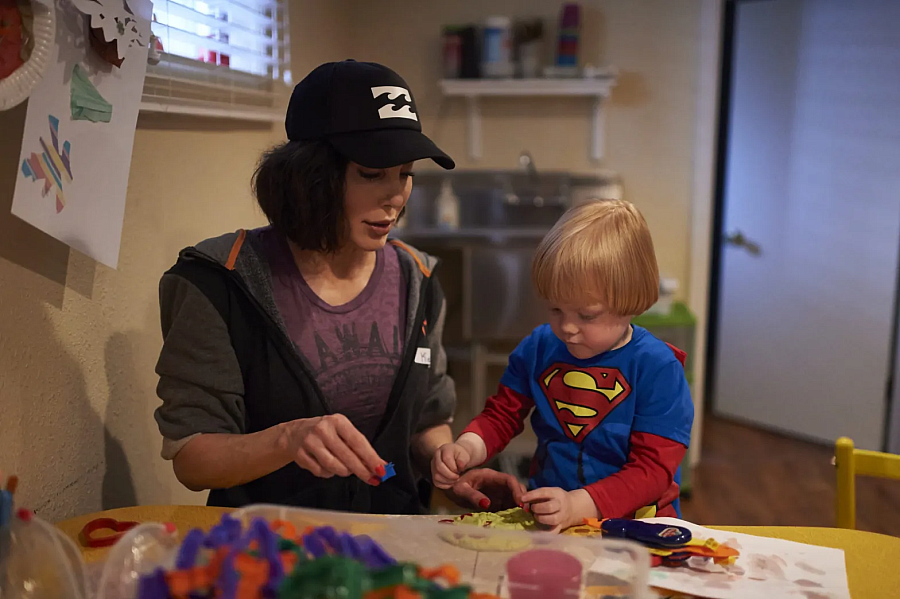 Person and child working on something