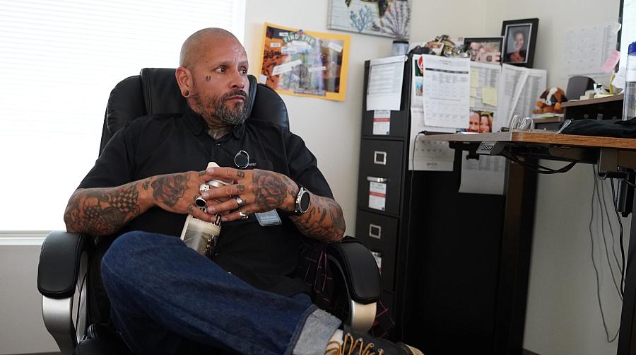 Person seated by a desk