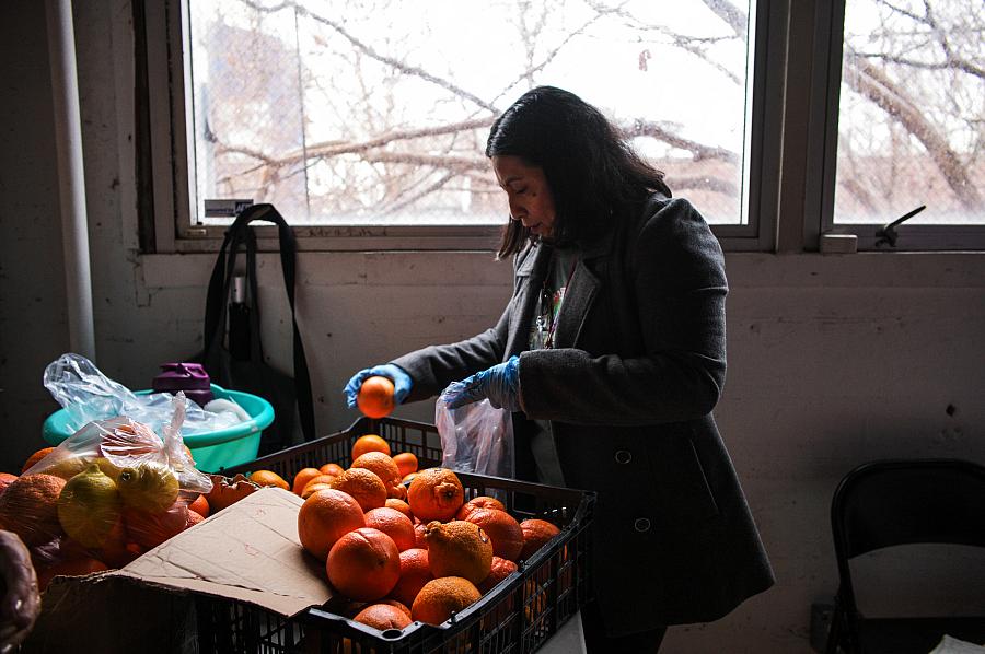 Woman sorting oranges