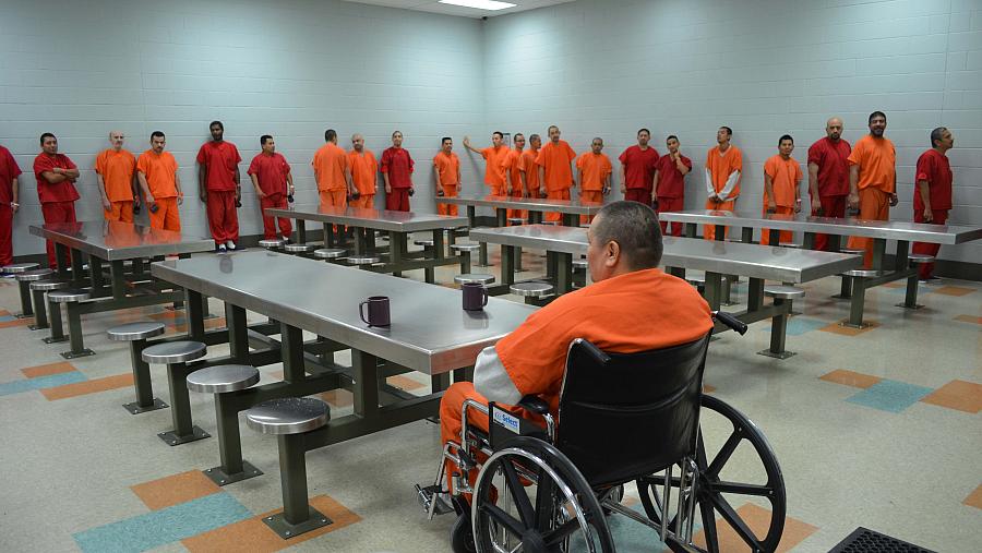 Prisoners standing in line at the dining area