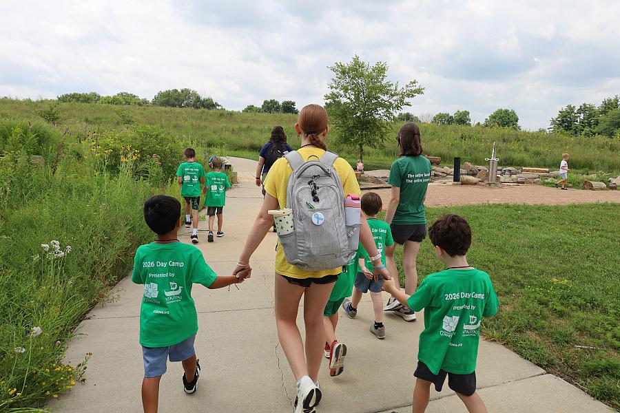 Person walking with two children