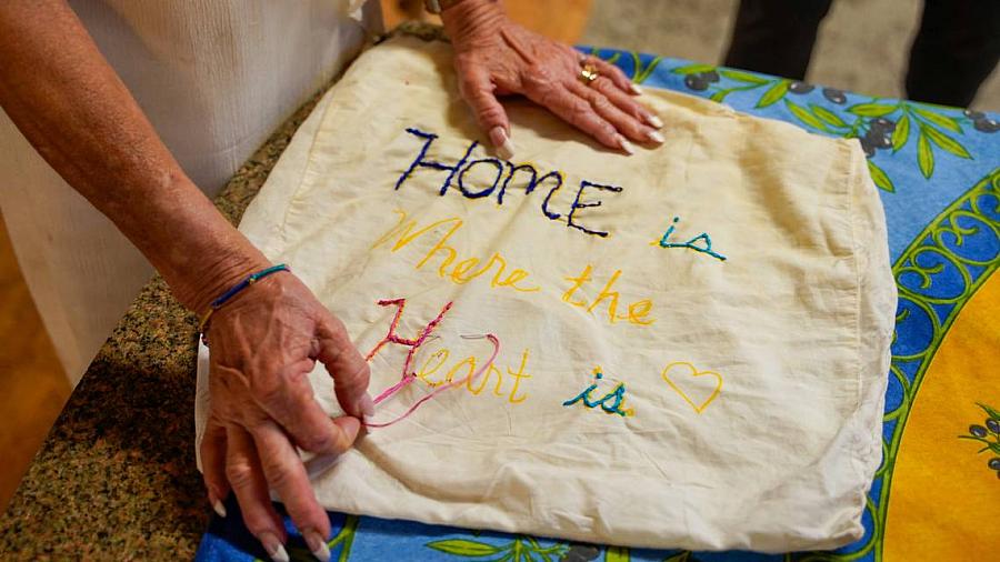 Person stitching a bag