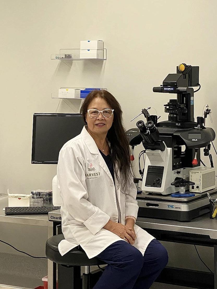 a woman wearing a lab coat
