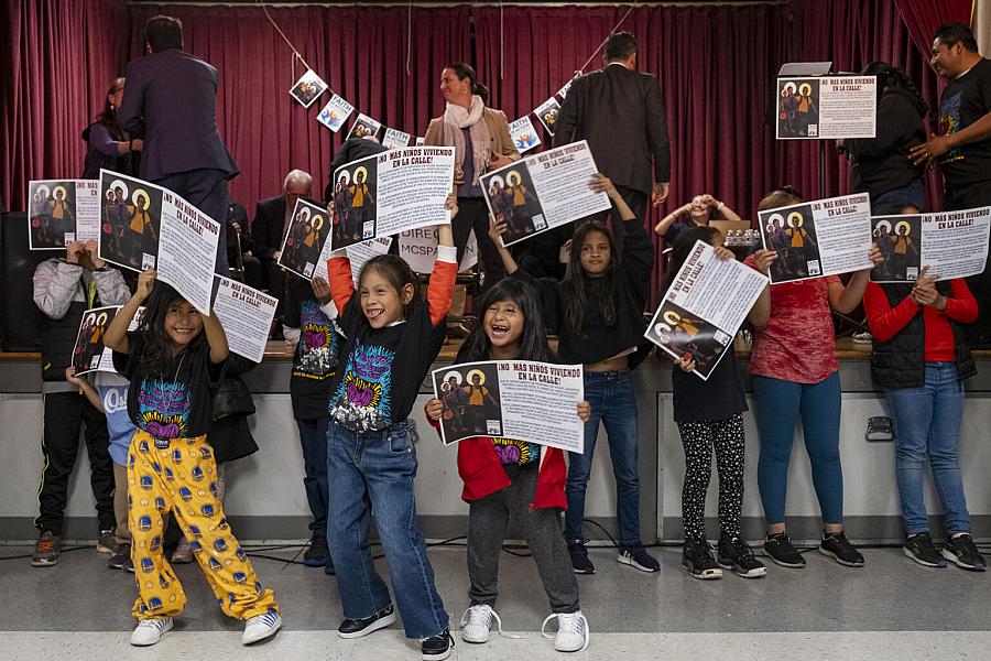 children holding posters