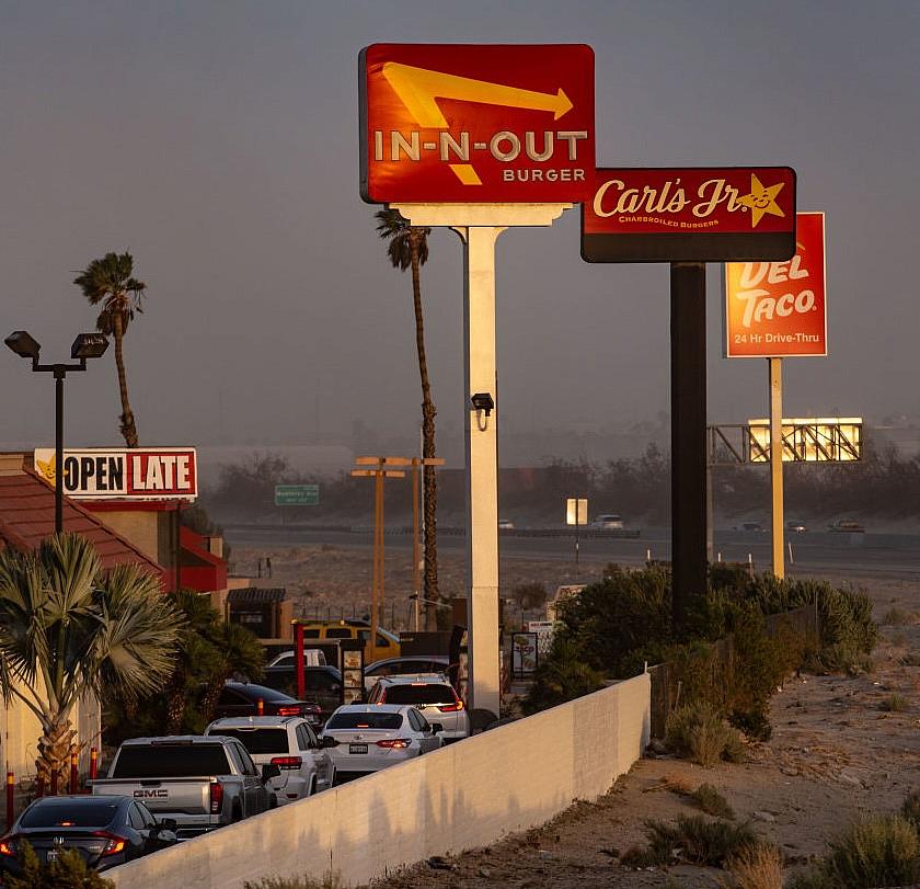 Cars wait in a queue amid several fast food restaurants in Southern California.