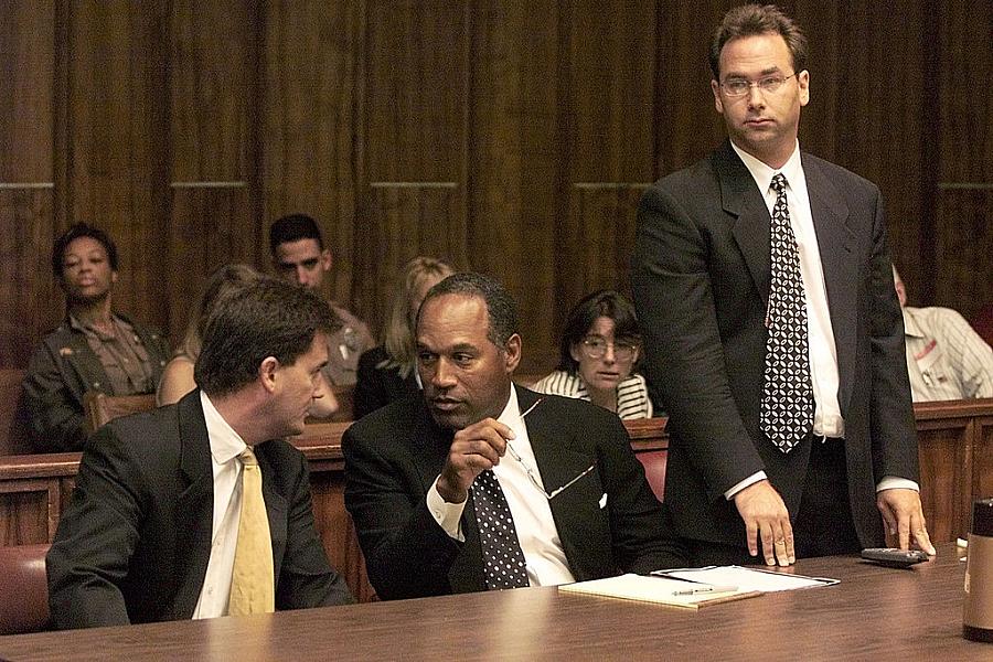 OJ Simpson, flanked by lawyers.