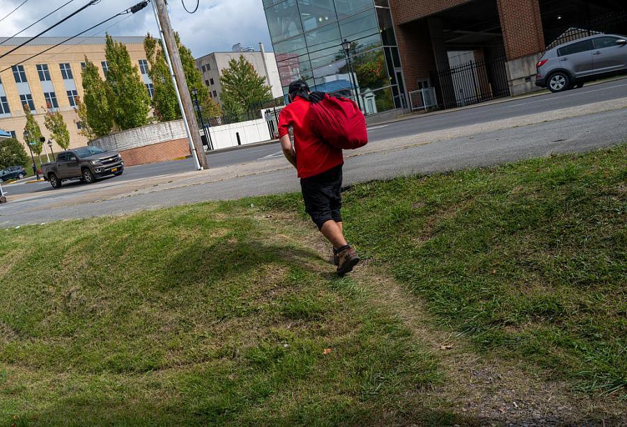 A man leaves a small distribution site for the homeless.