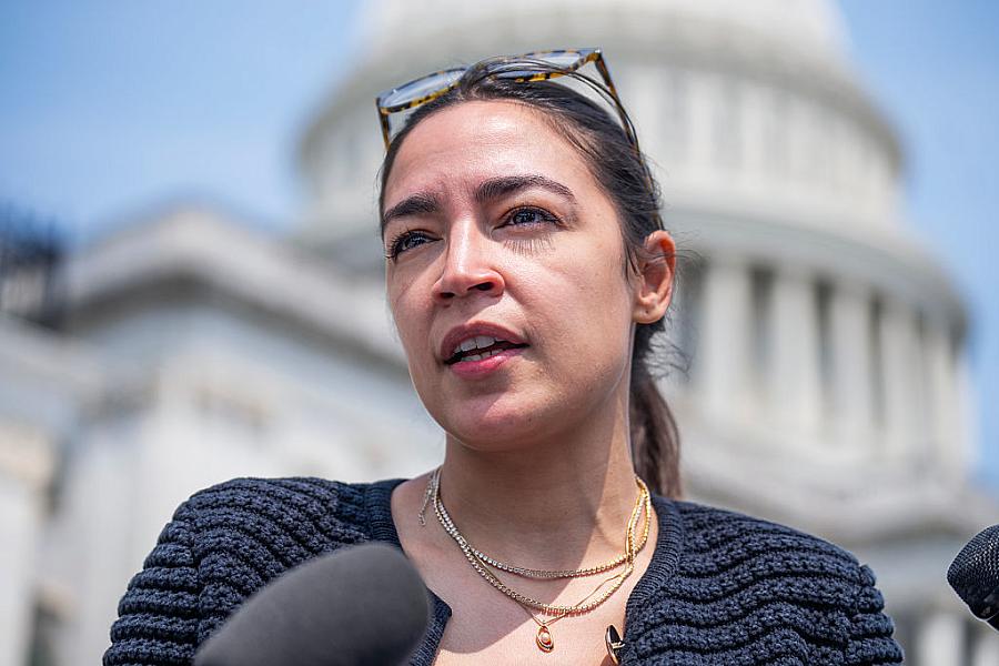 Rep. Alexandria Ocasio-Cortez talks with reporters outside the U.S. Capitol in July.