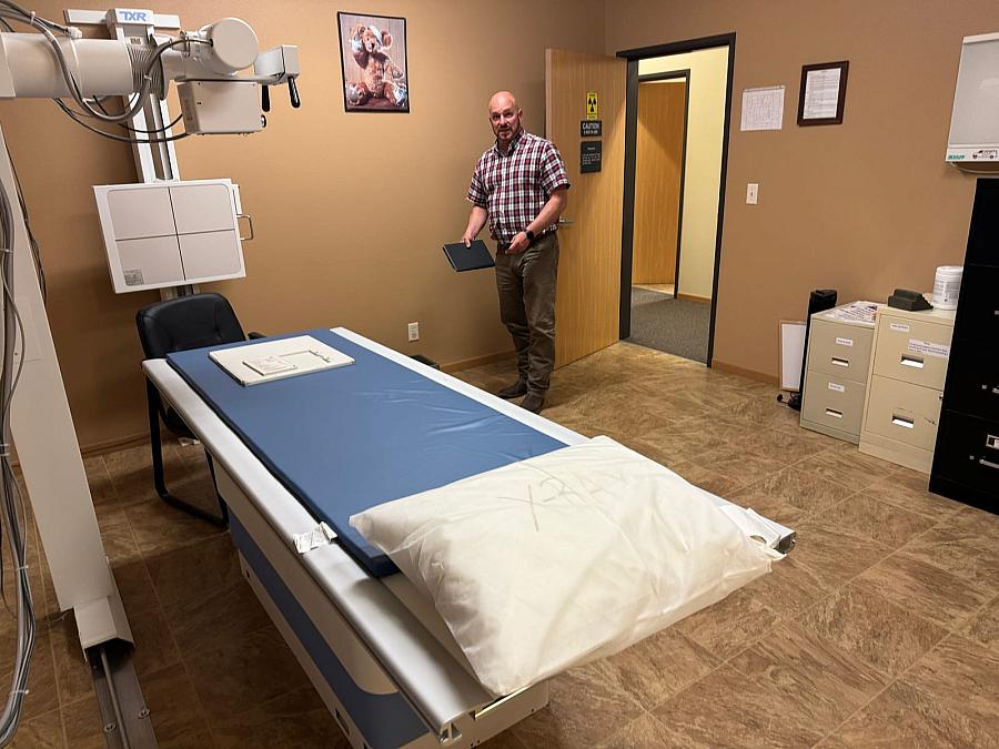 Person standing by medical equipment