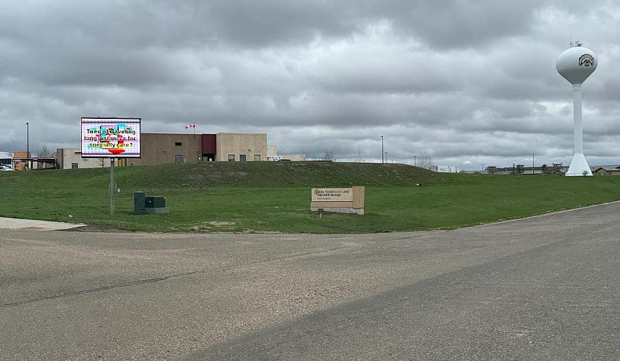 A road with a building in the distance