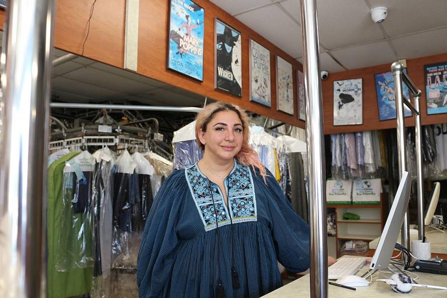 Person standing in front of laundry hung up