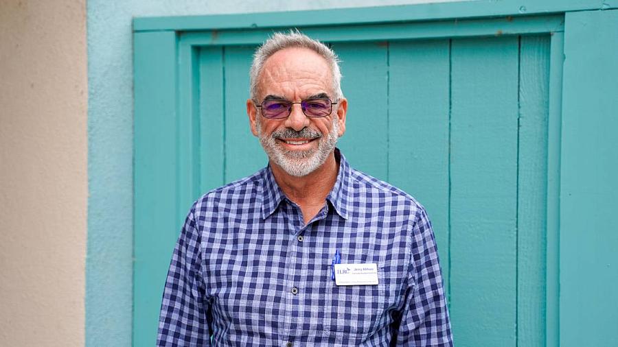 Person in front of a blue door