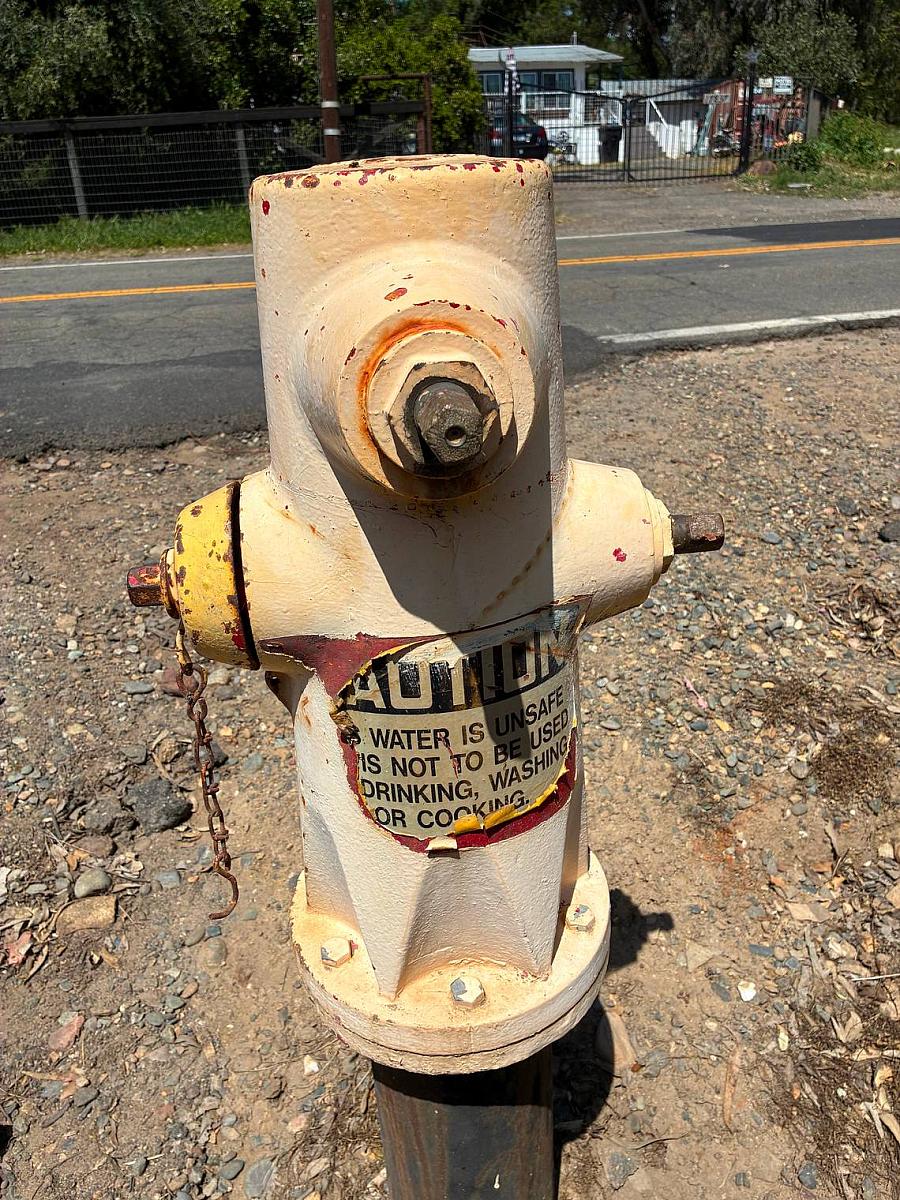 A metalic water pump by roadside