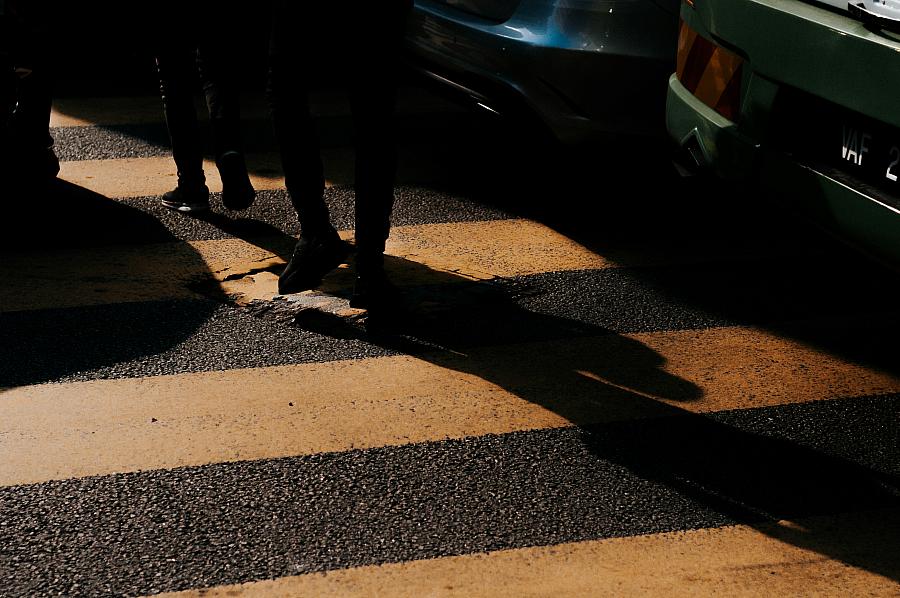Person walking in dark alley