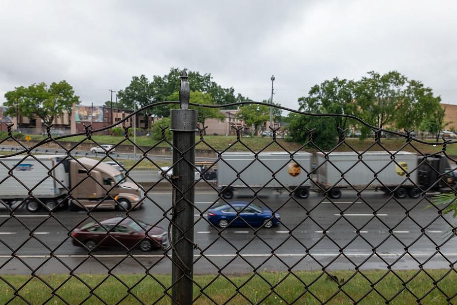 Highway visible through a fence