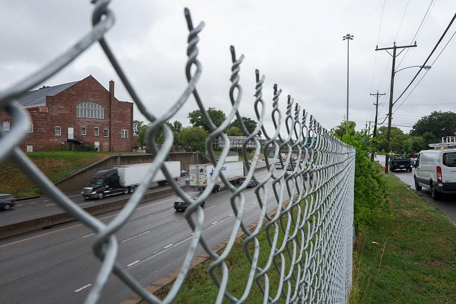 Highway visible through a fence