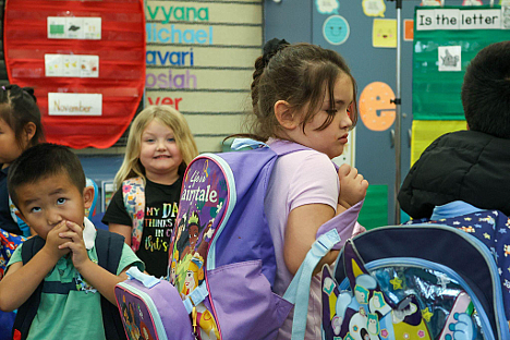 Children waiting to be picked up at a school
