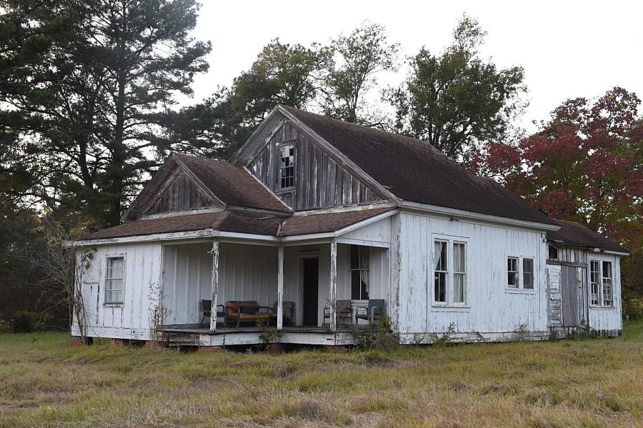 Old building surrounded by grass