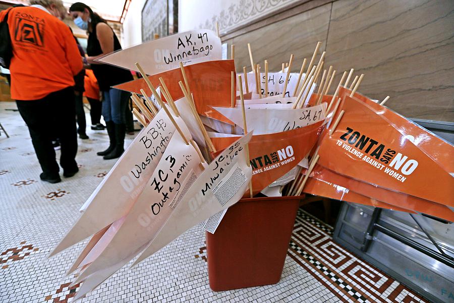 Orange and white banners of domestic columns in a bucket