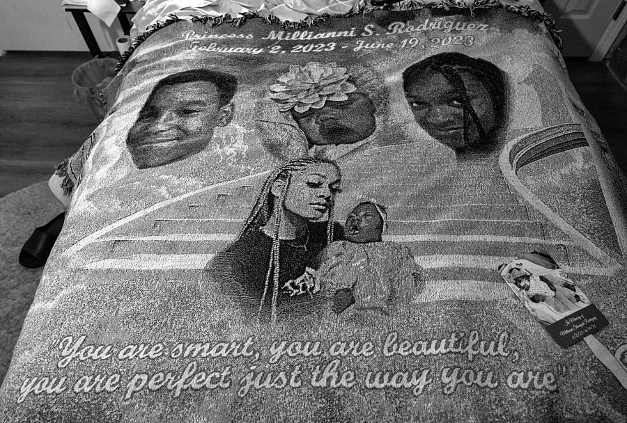 Blanket with people and childrens faces on it