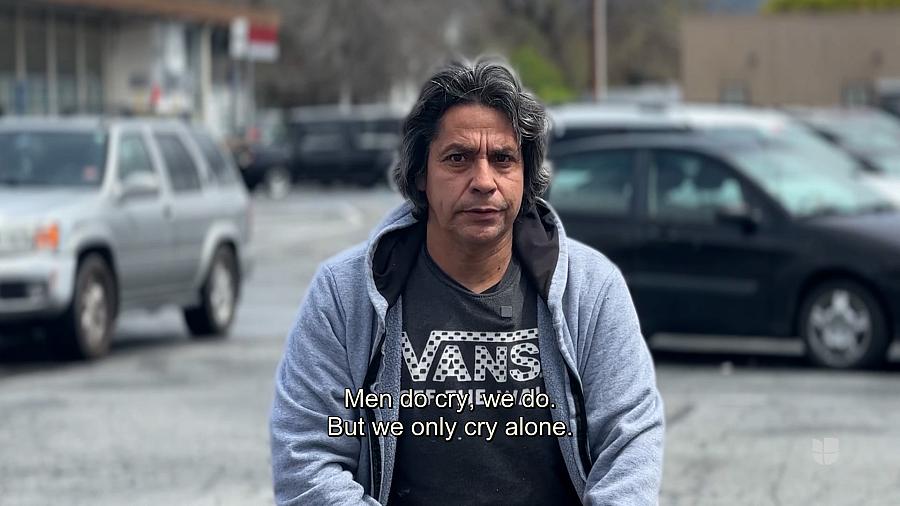 person standing in front of cars