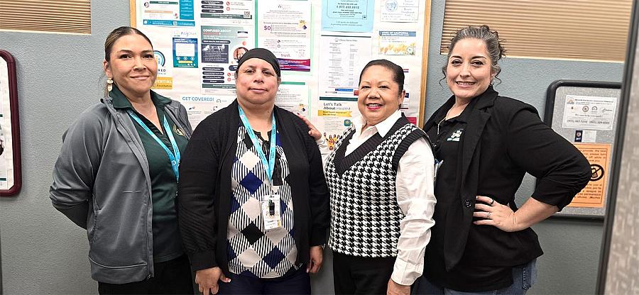 Four women stand inside the East Bakersfield's Clinica Sierra Vista