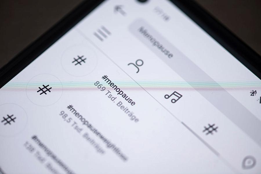 Mobile phone with social media application open on it