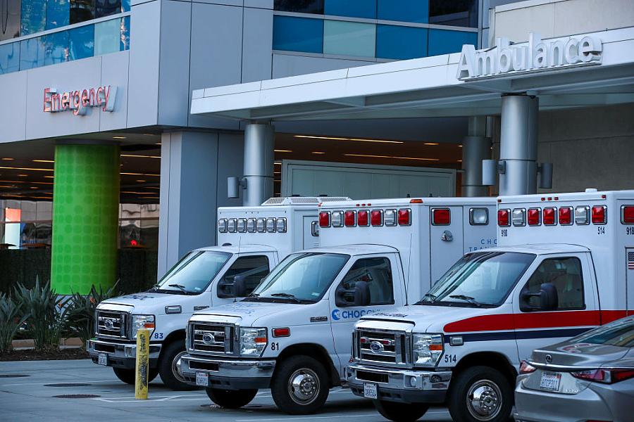 Ambulances parked by the emergency section of a hospital