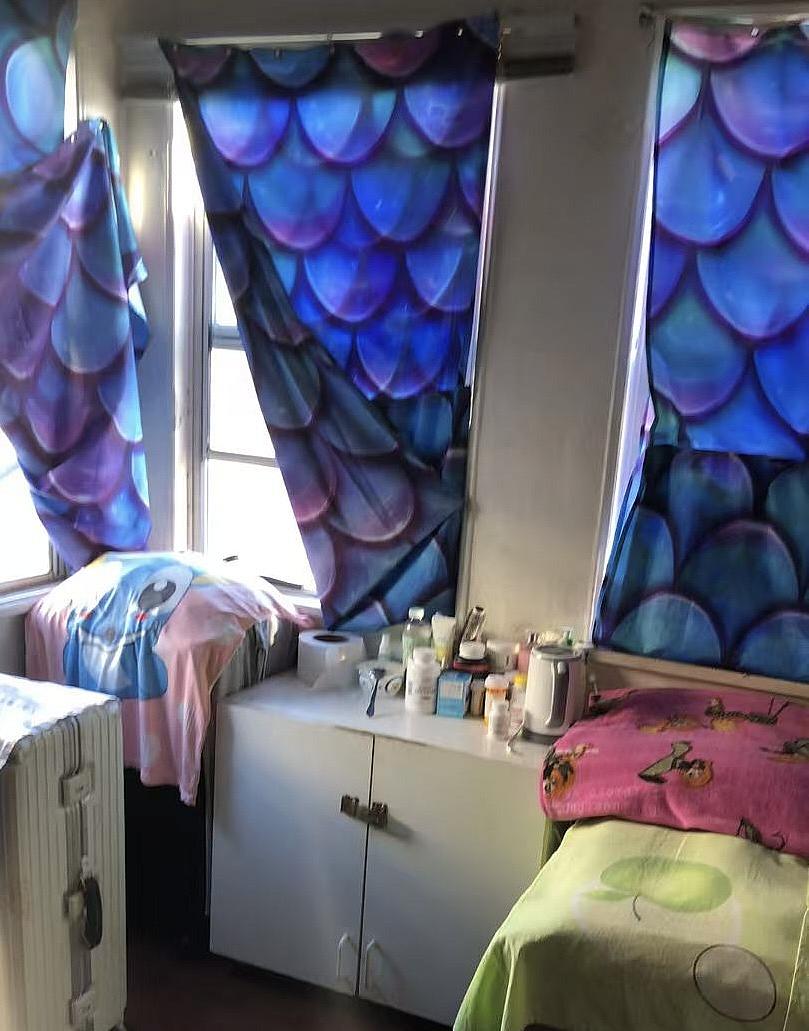 a room with a bed and a cabinet