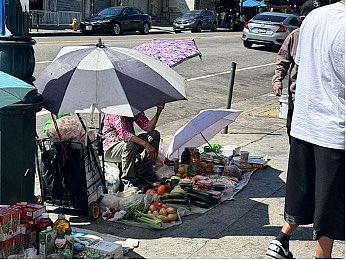A fruitmonger seeling fruits on the street