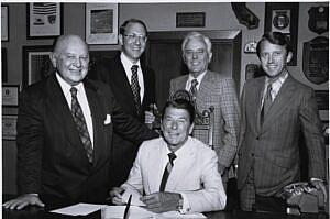 Black and white picture of a group of people in suits