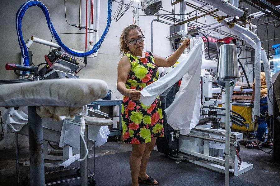 person examining a shirt