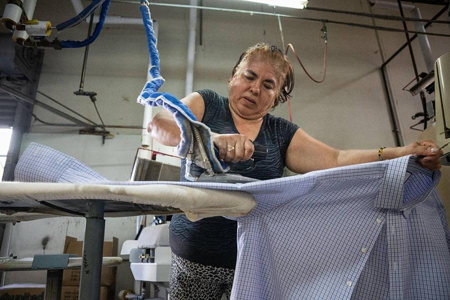 Person ironing shirt