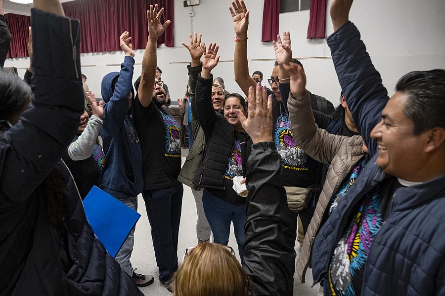 Image of people raising hand