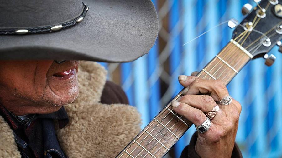 Person playing a guitar