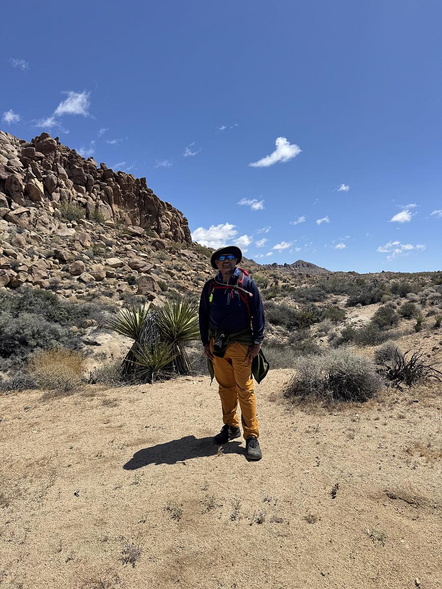 A Sri Lankan Tamil man stands in Joshua Tree National Park