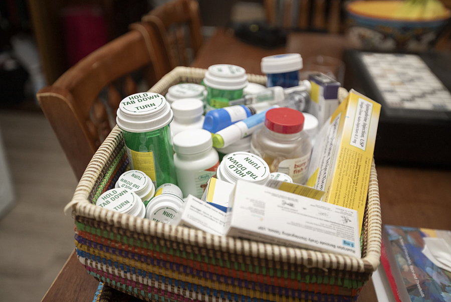 Container full of medication bottles