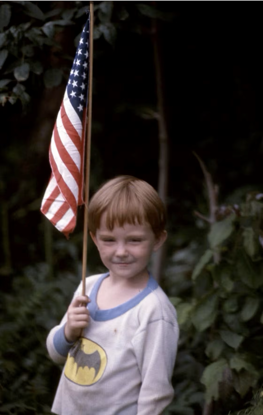 Child holding an American flag