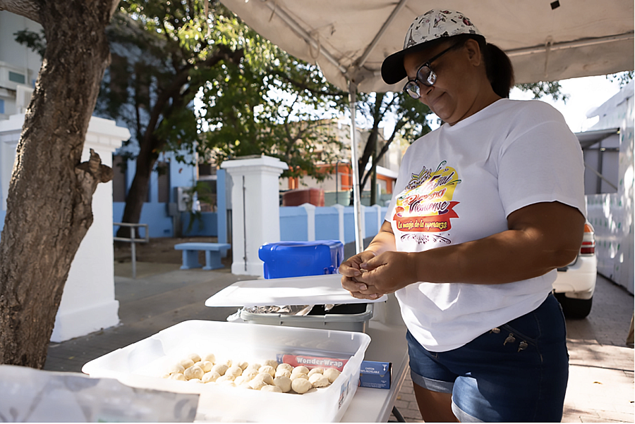 Person in a cap preparing food