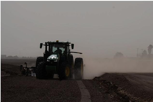 a tractor with a hazy background 