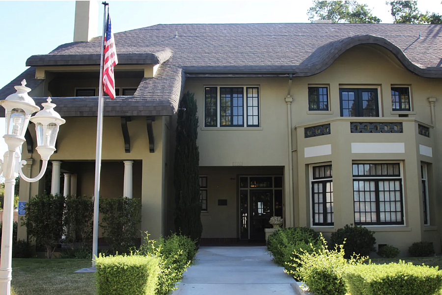 Building with a flag in front of it