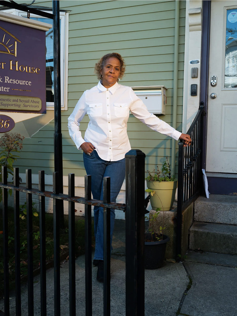 Person standing by a building entrance 