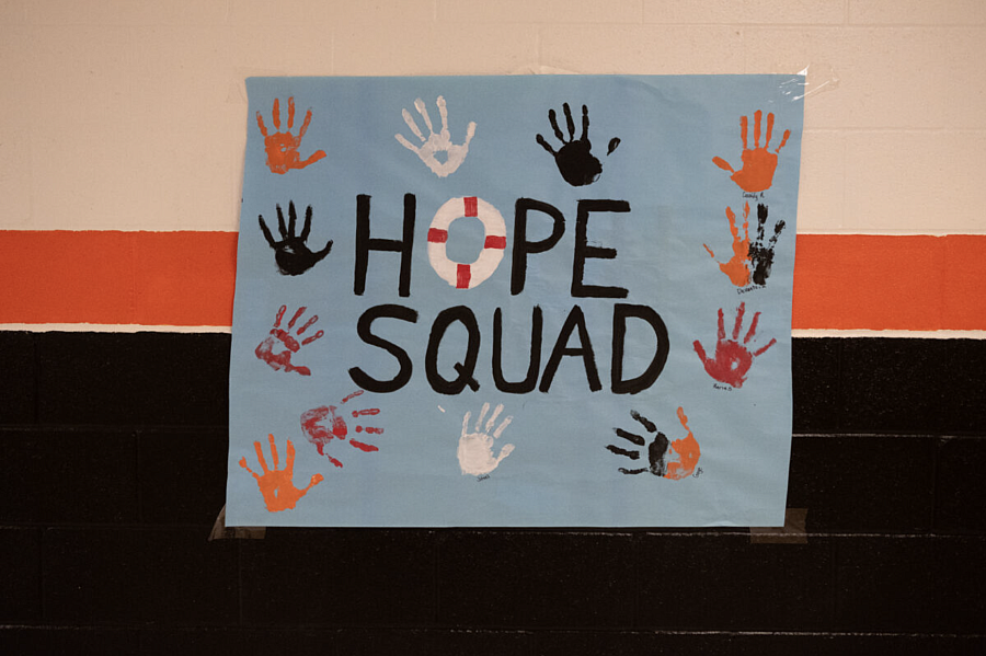 'Hope Squad' sign with hand prints