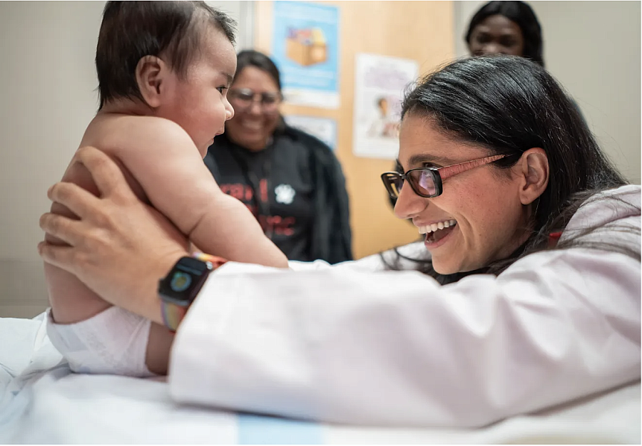 Person smiling at a baby