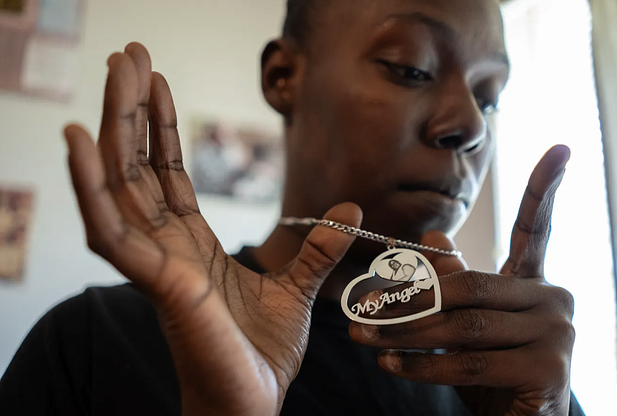 Person holding a silver necklace