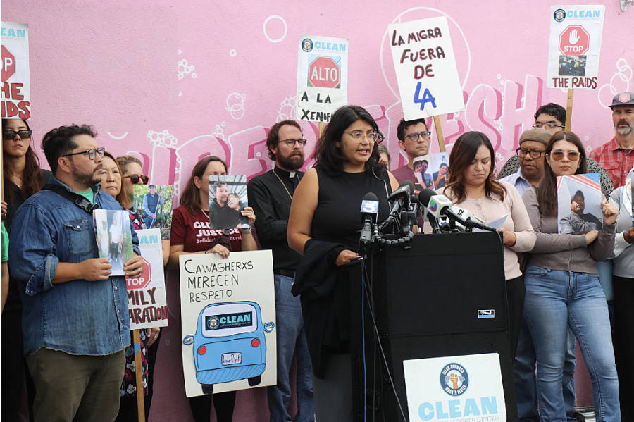 Sandra de Anda advocates for carwash workers at a press conference outside a car wash that was raided by ICE in September of 2025. 