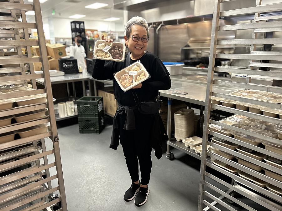 Person holding a plate of food