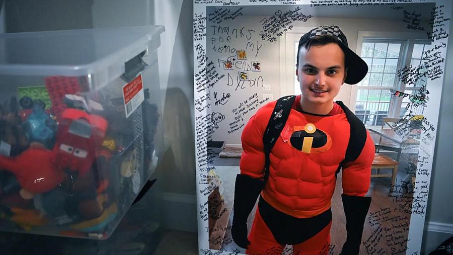An image of Zachary Chafos, dressed as Mr. Incredible, at his Maryland home