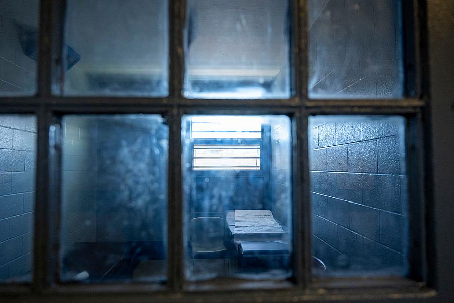 A dark room seen through a window